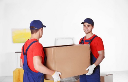 Packing boxes and materials for a move in Paddington