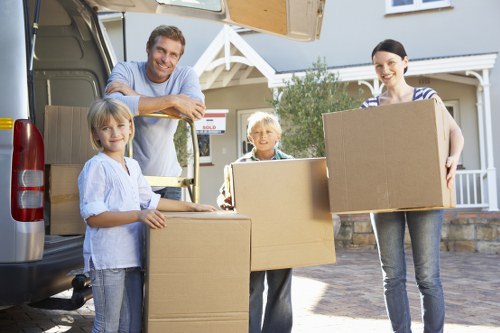 Close-up of moving boxes and furniture prepared for same day transport